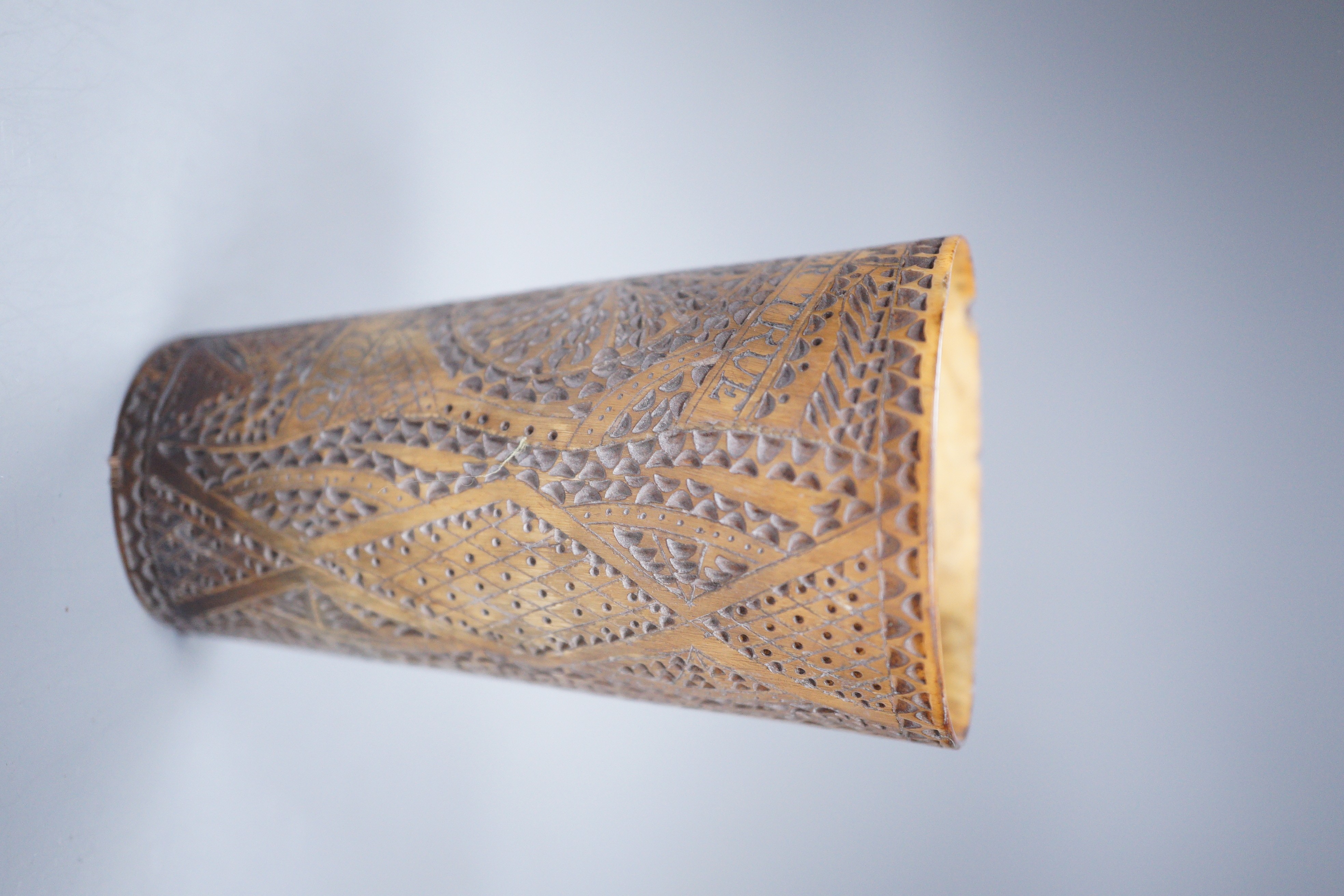 A 19th century carved horn beaker, titled ‘Ship Peru’, dated ‘Feb 12th 1840’, initialled ‘W.M’, the reverse carved ‘FOREVER TRUE ALWAYS YOURS’, height 10cm